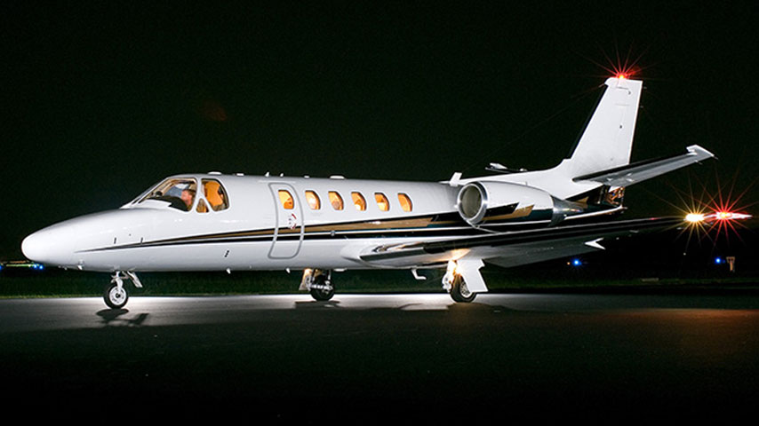 Citation Bravo Light Jet on Private Airport runway at night